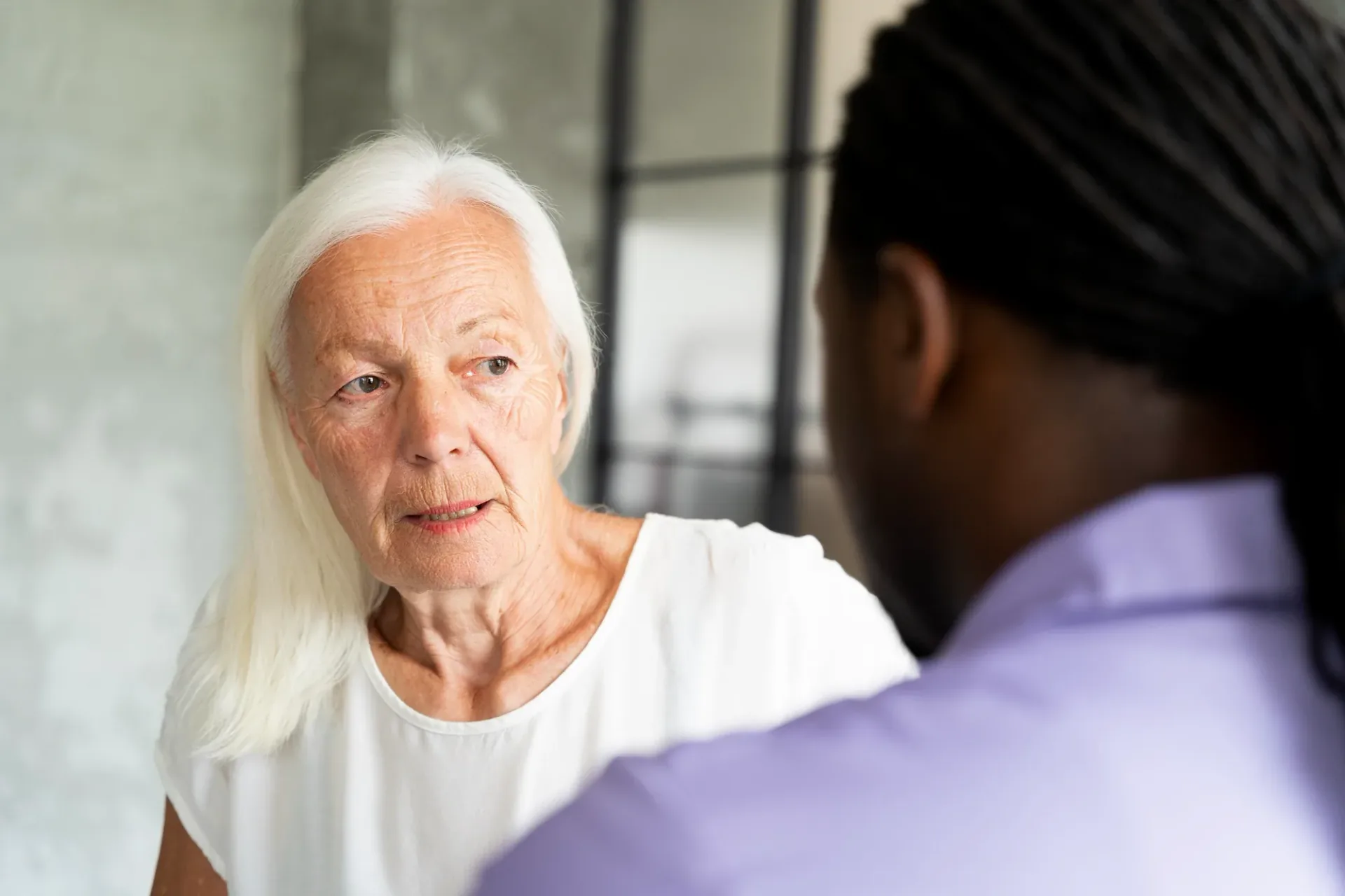 Care worker speaking with an older person