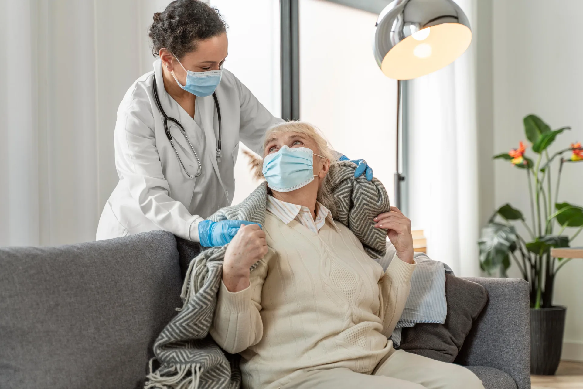 Healthcare worker supporting an older person during reablement care