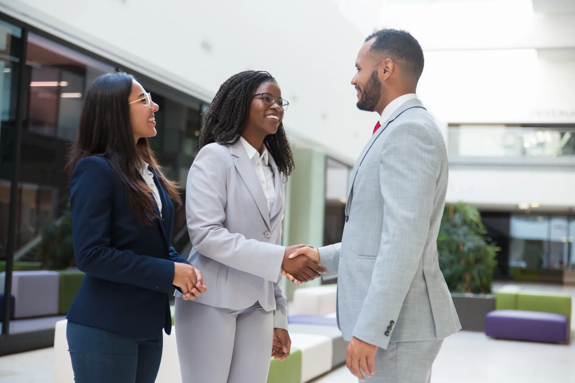 Healthcare professionals shaking hands after positive feedback