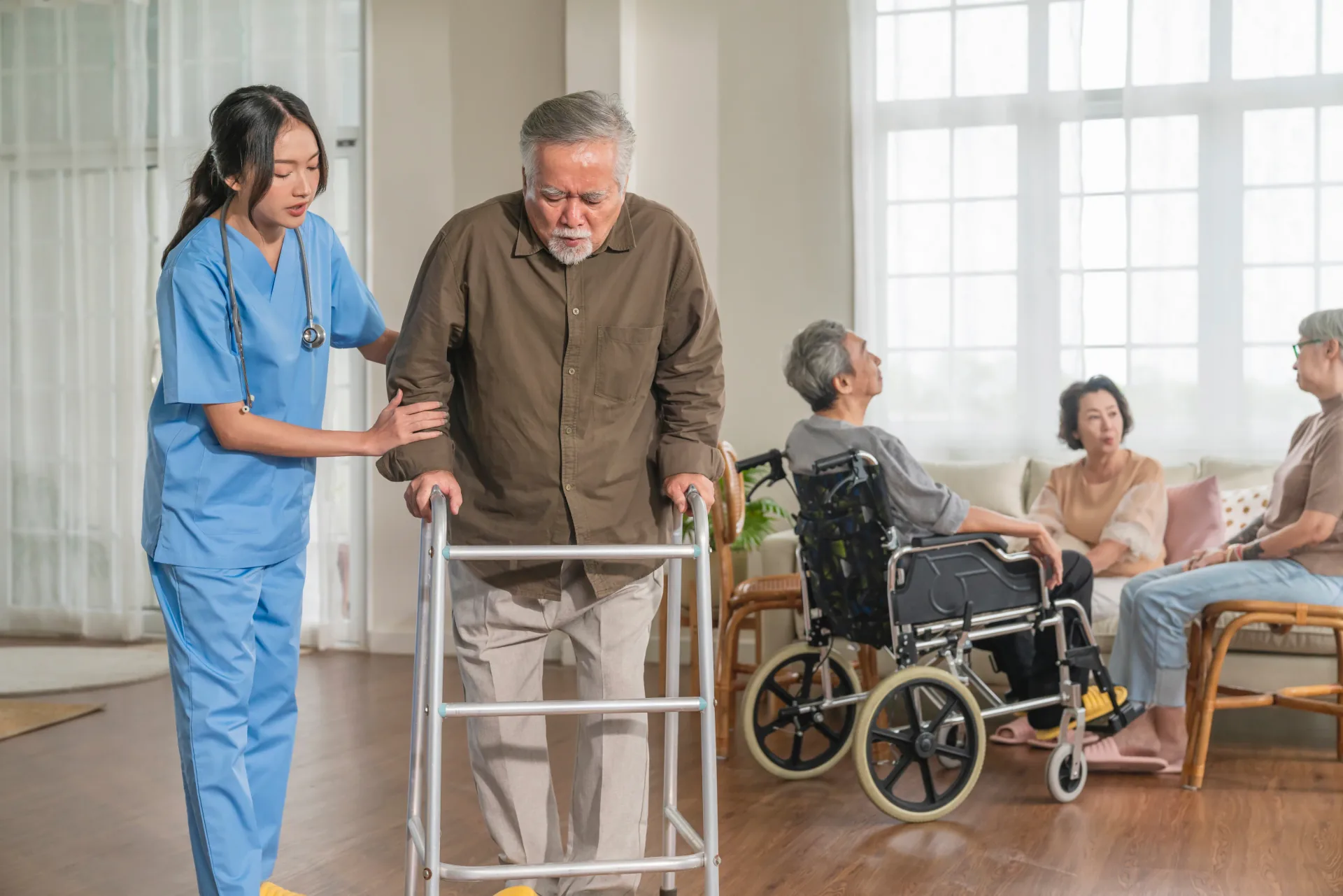 Care worker helping an older adult with mobility support