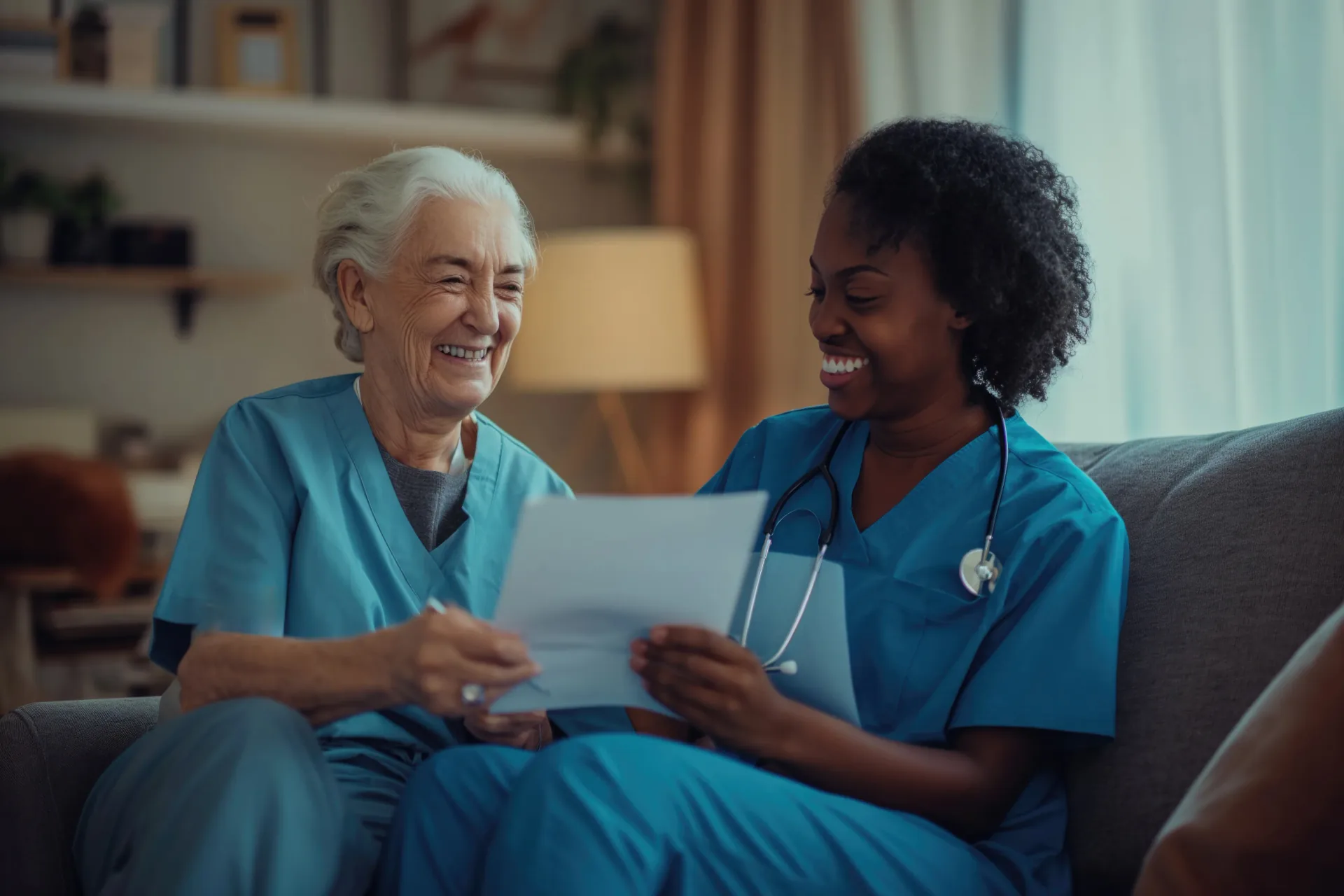 Care worker smiling with an older woman