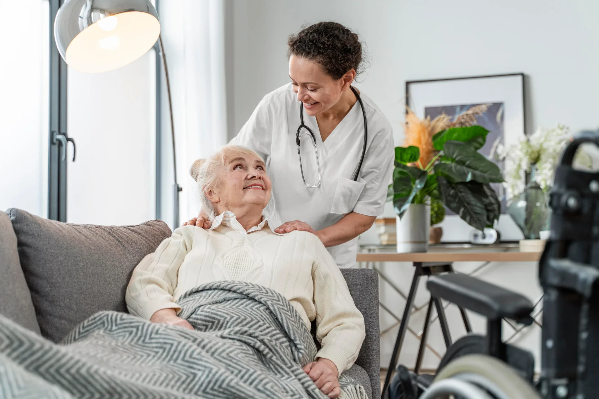 Care worker supporting an older person recovering at home