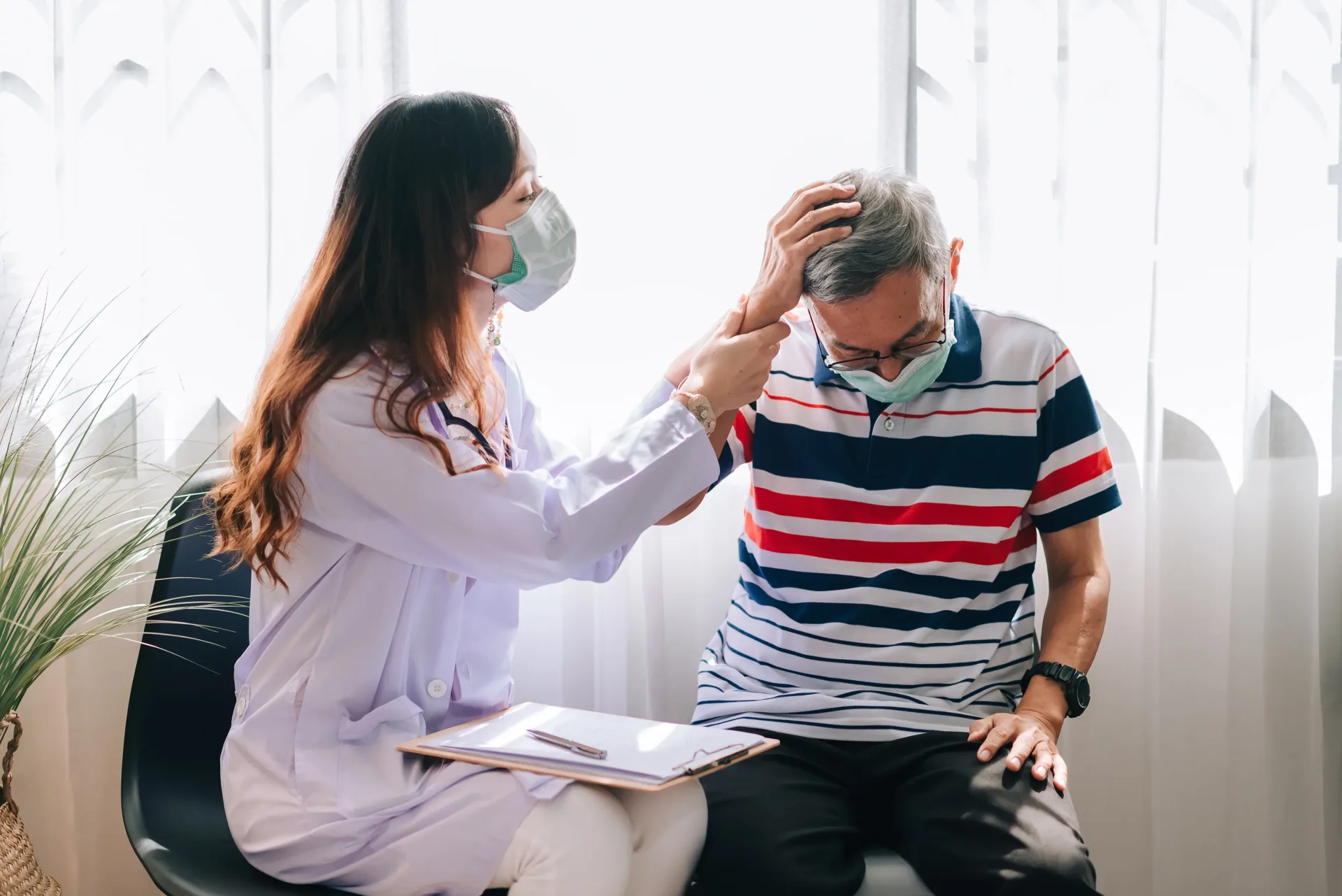 Healthcare worker supporting a person with multiple sclerosis