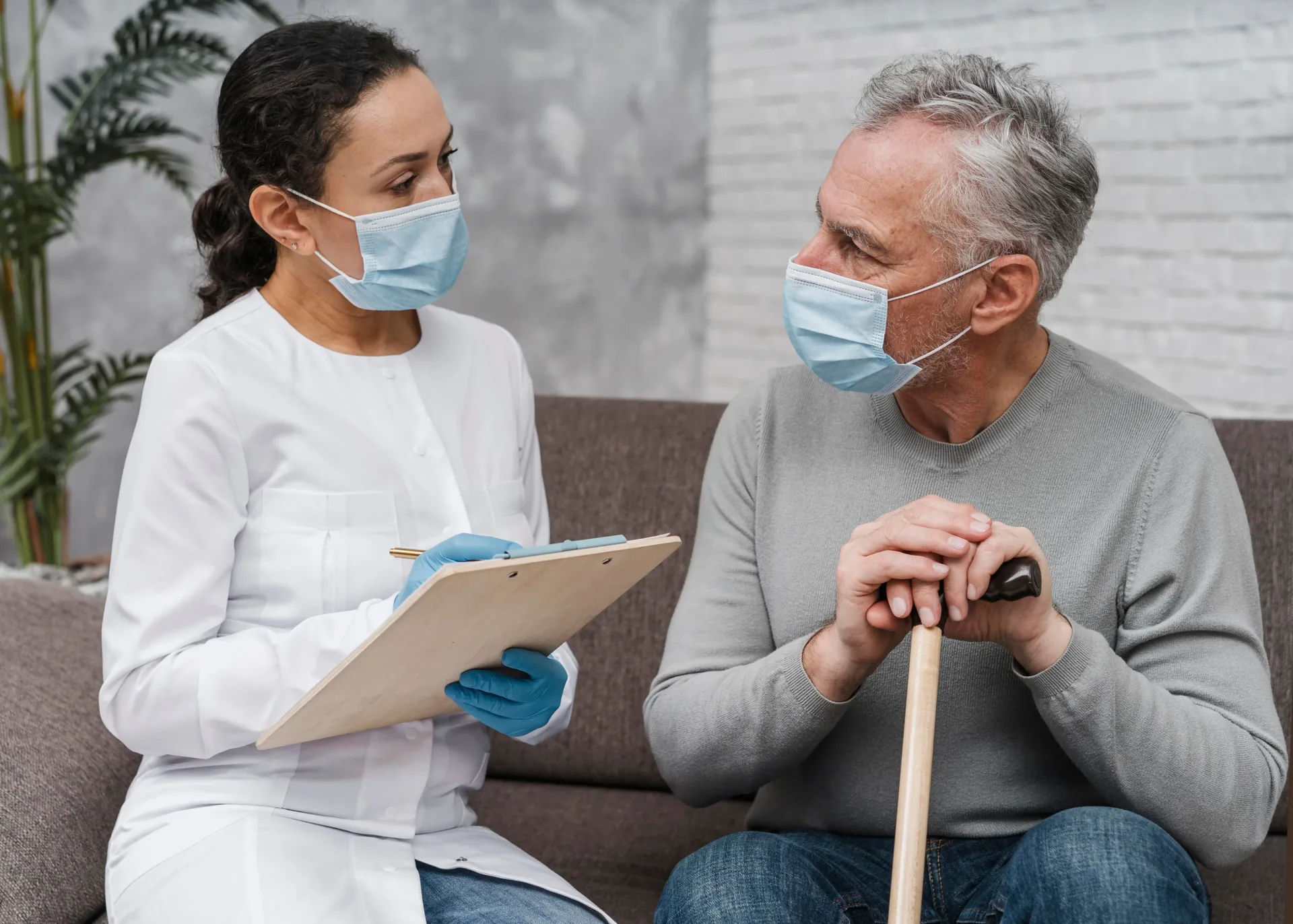 Healthcare worker speaking with an older adult