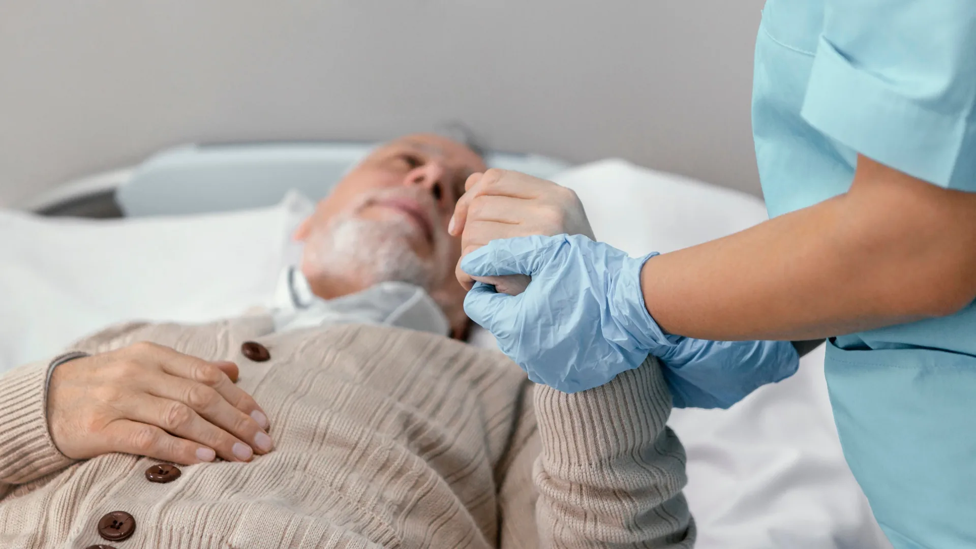 Care worker supporting an older person after stroke